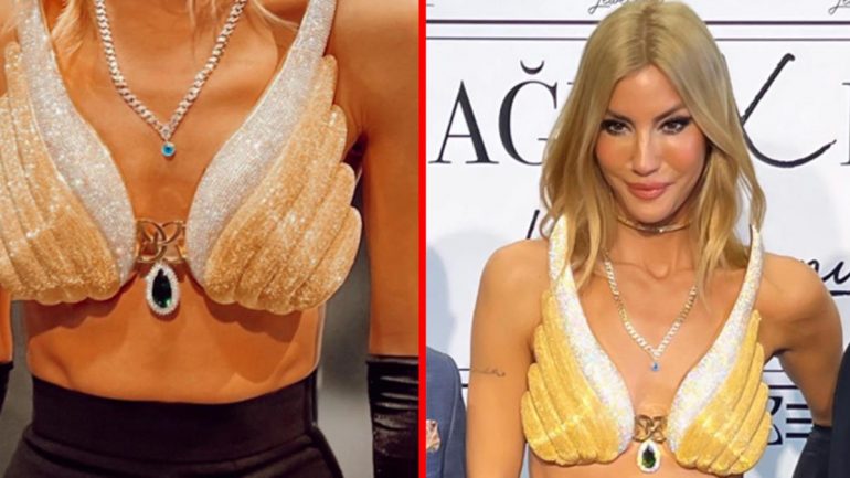 Çağla Şıkel, altın kaplama büstiyer giyerek fuara damga vurdu